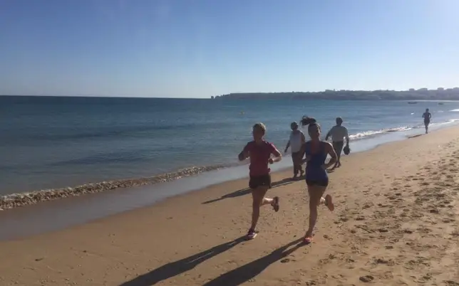 runners on the beach